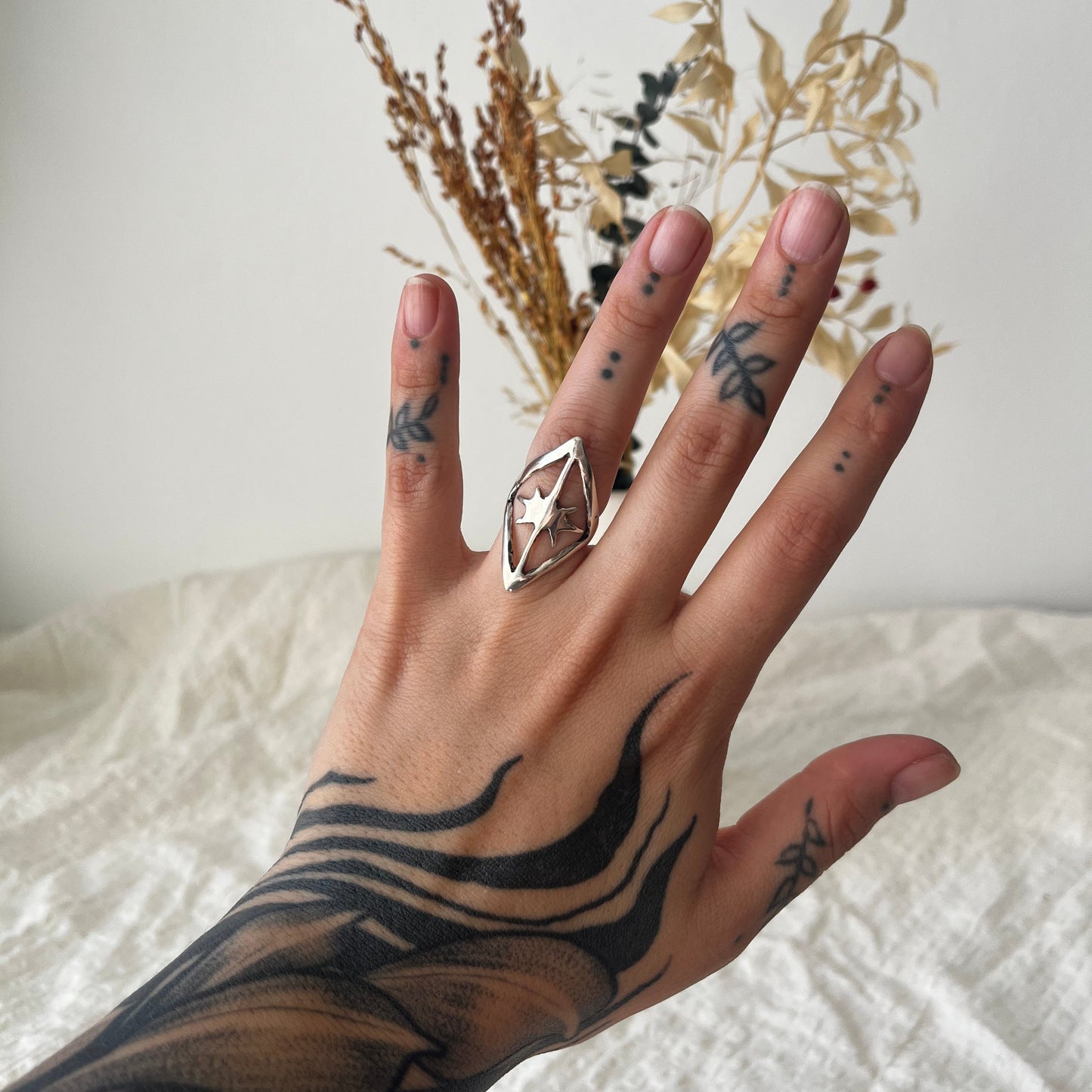 Handmade ring in sterling silver with a star inside a kite shape