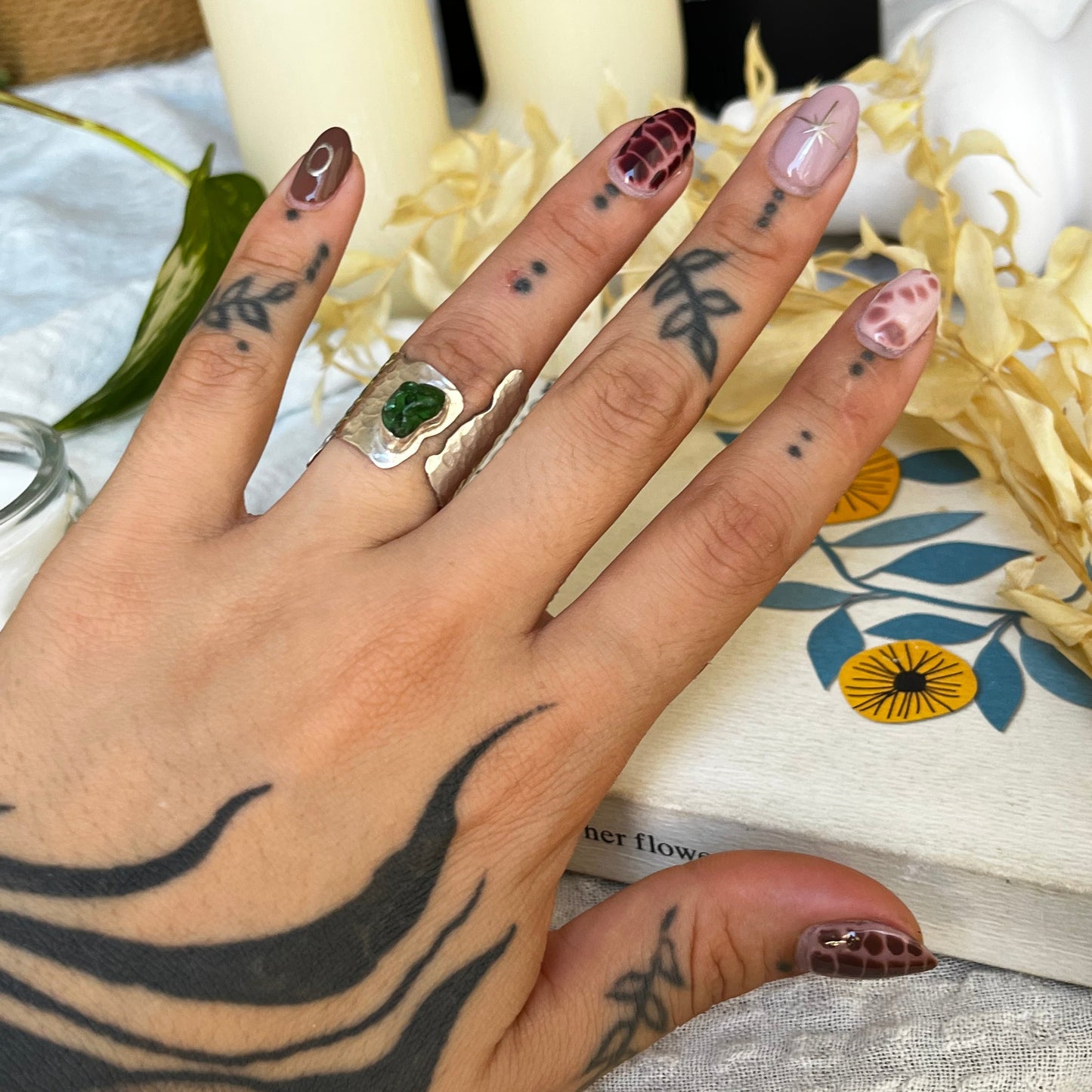 Wide band ring made of sterling silver with a sea glass center