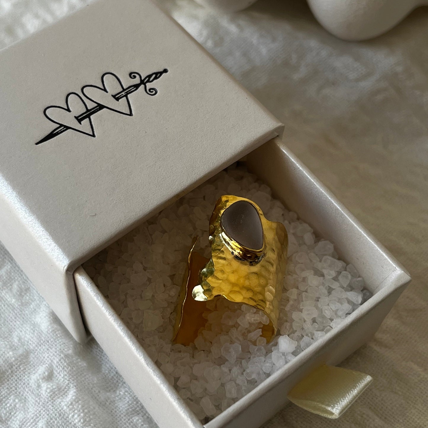 Wide band ring gold plated with a sea glass center