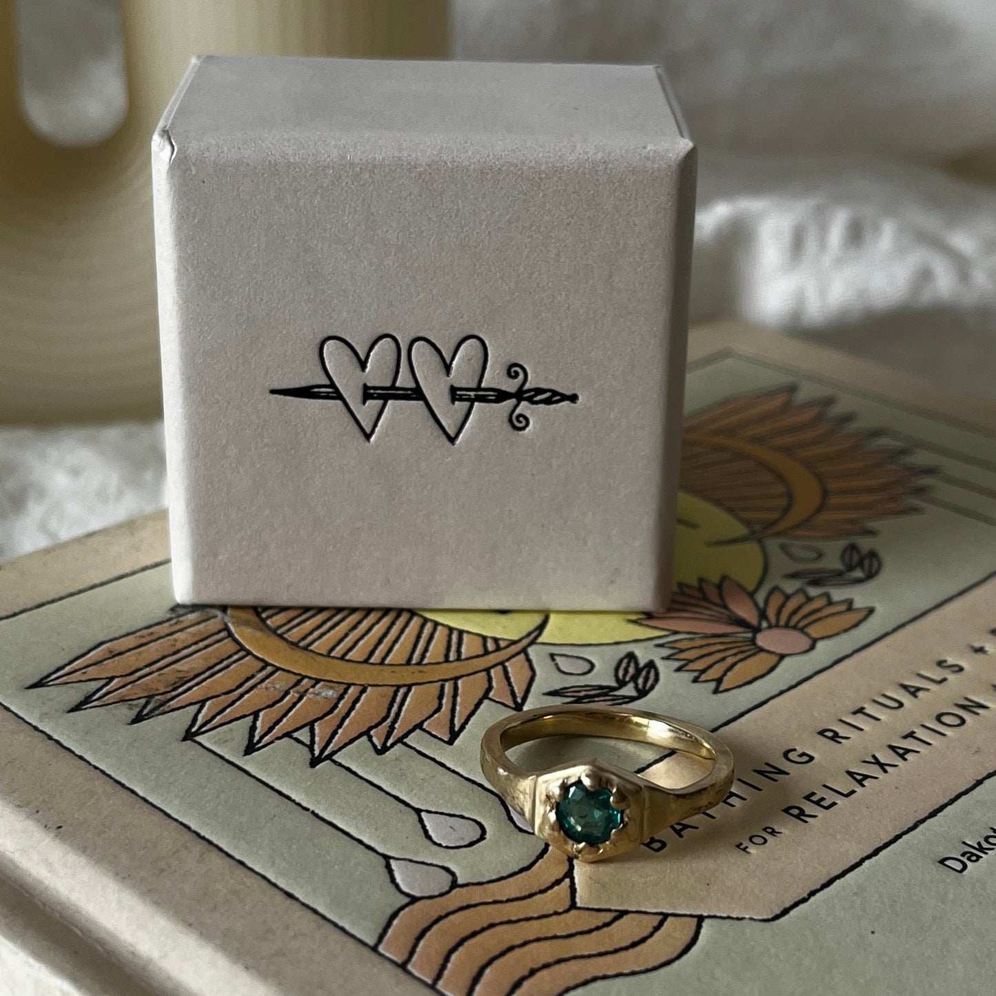 9kt solid gold engagement ring with a green emerald