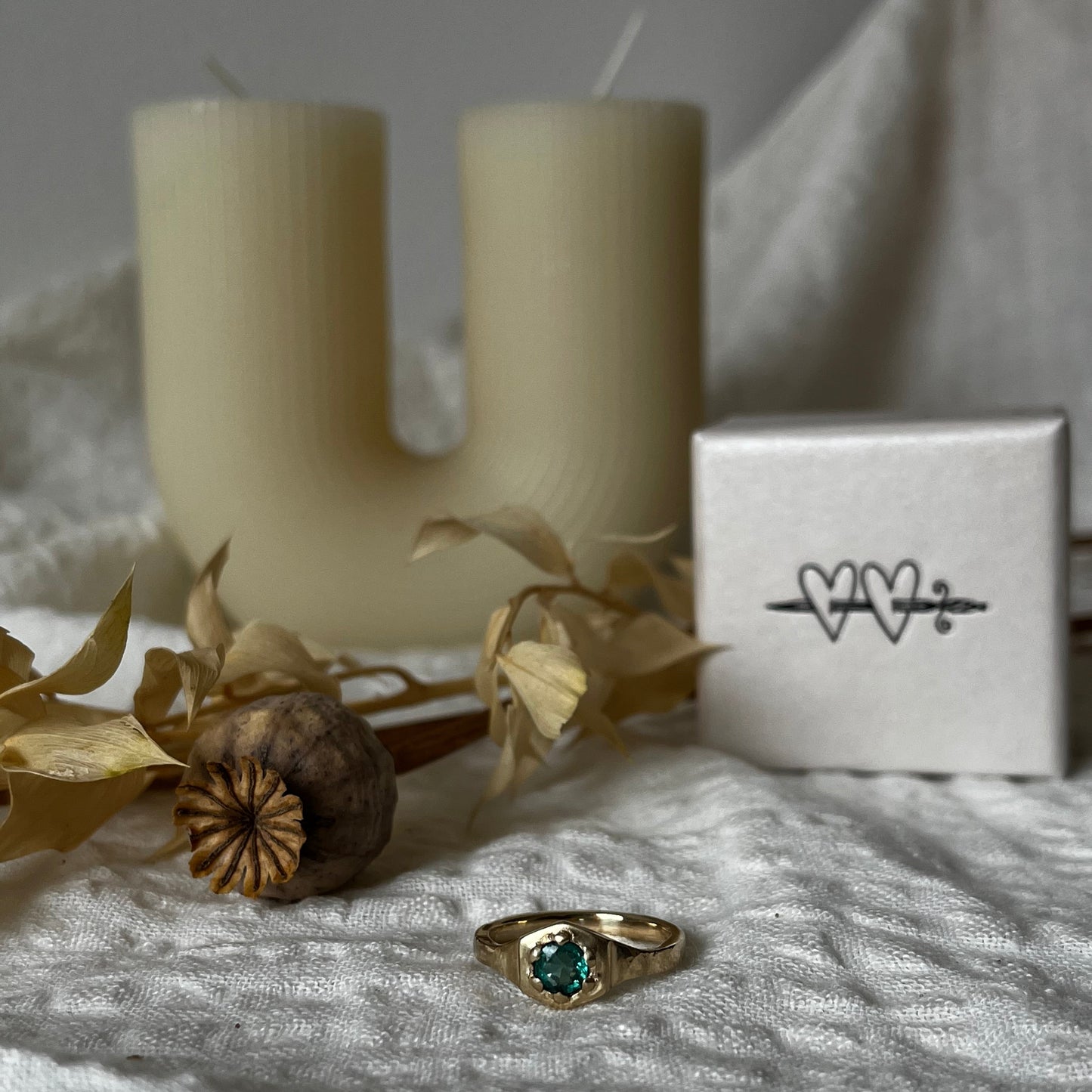 9kt solid gold engagement ring with a green emerald