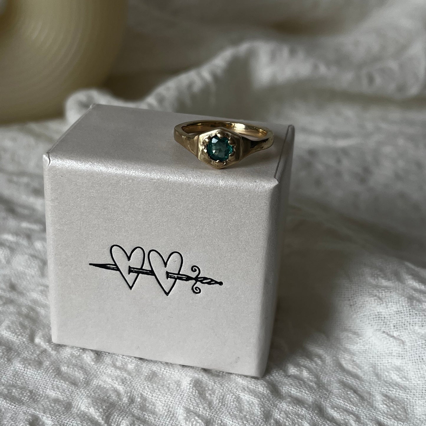 9kt solid gold engagement ring with a green emerald