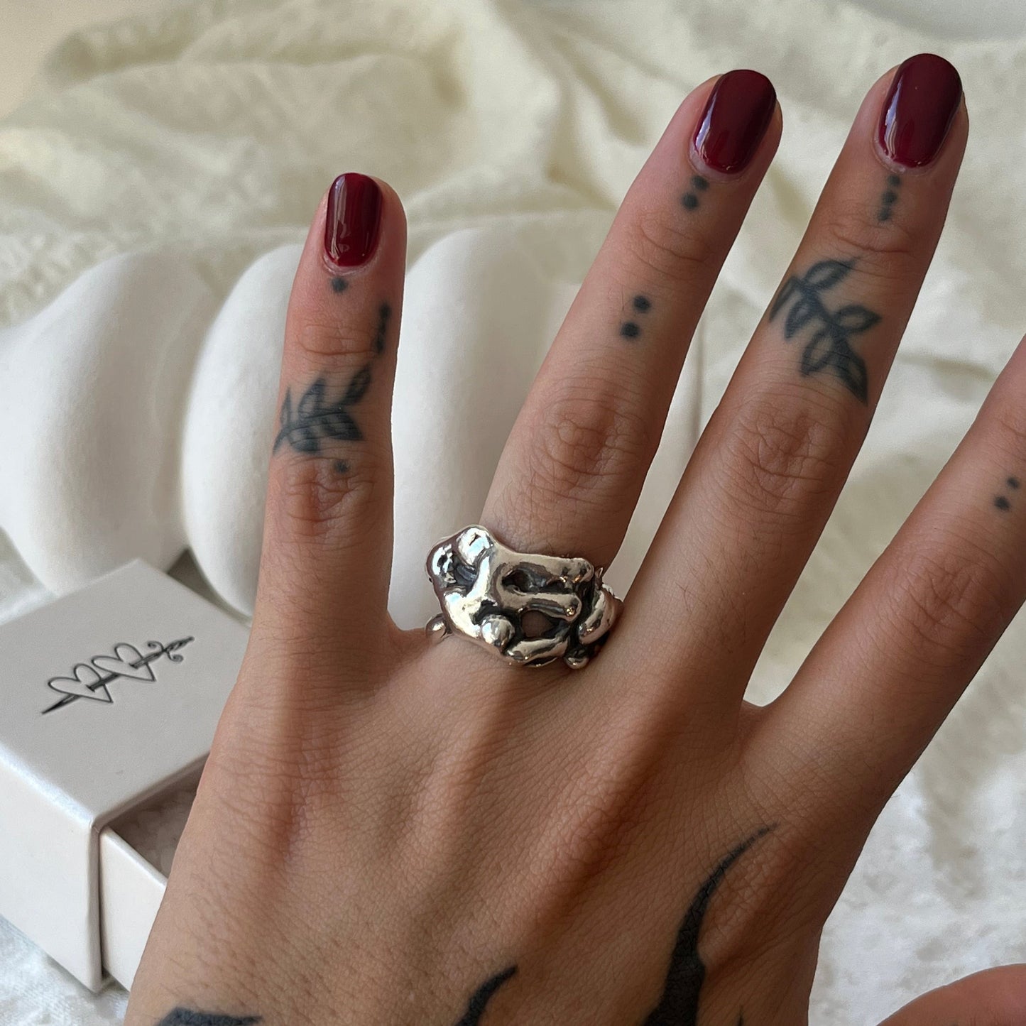 Hand made sterling silver ring with a molten design