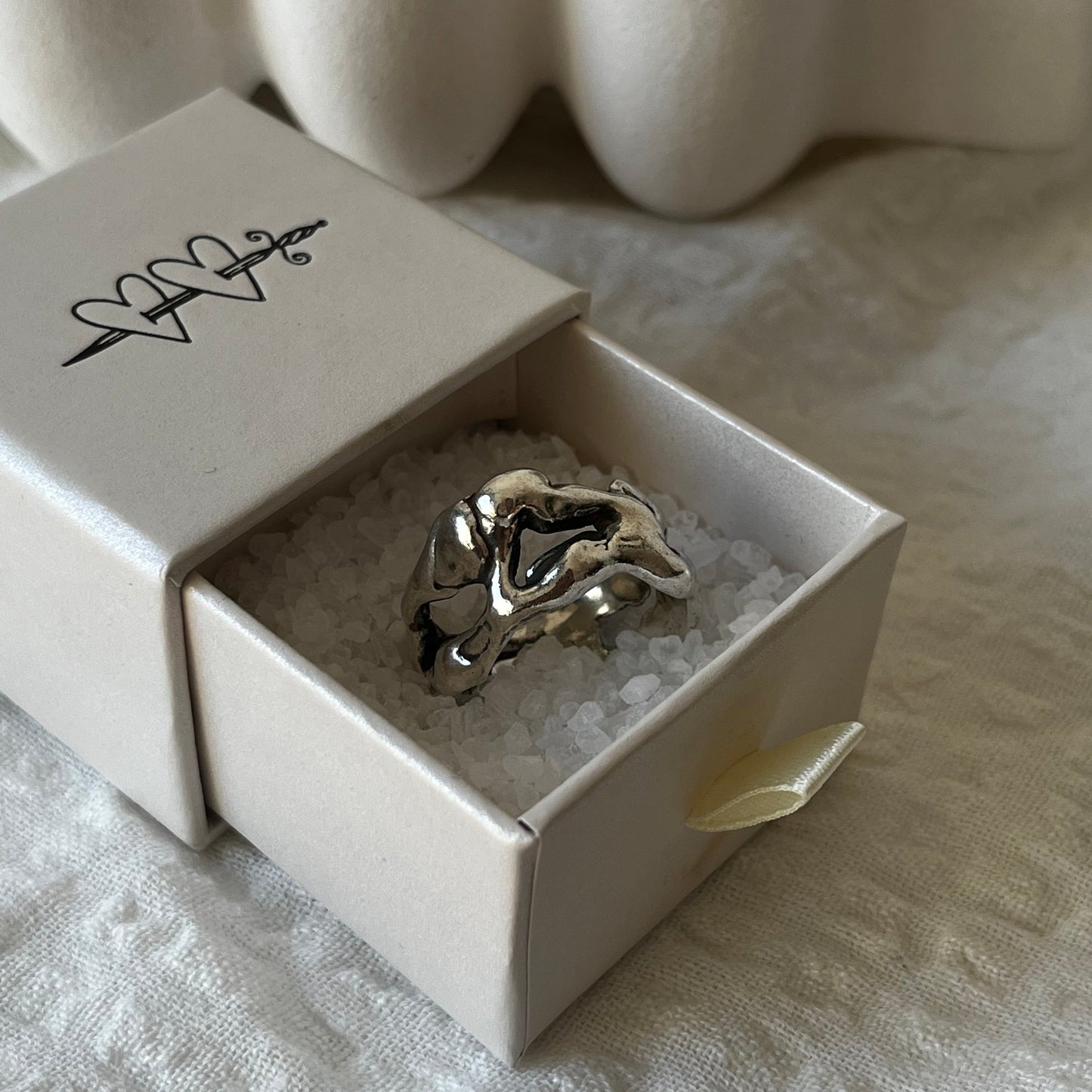Hand made sterling silver ring with a molten design