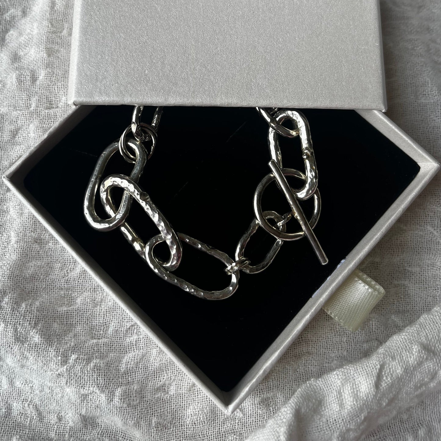 Raw style bracelet hand-forged in sterling silver