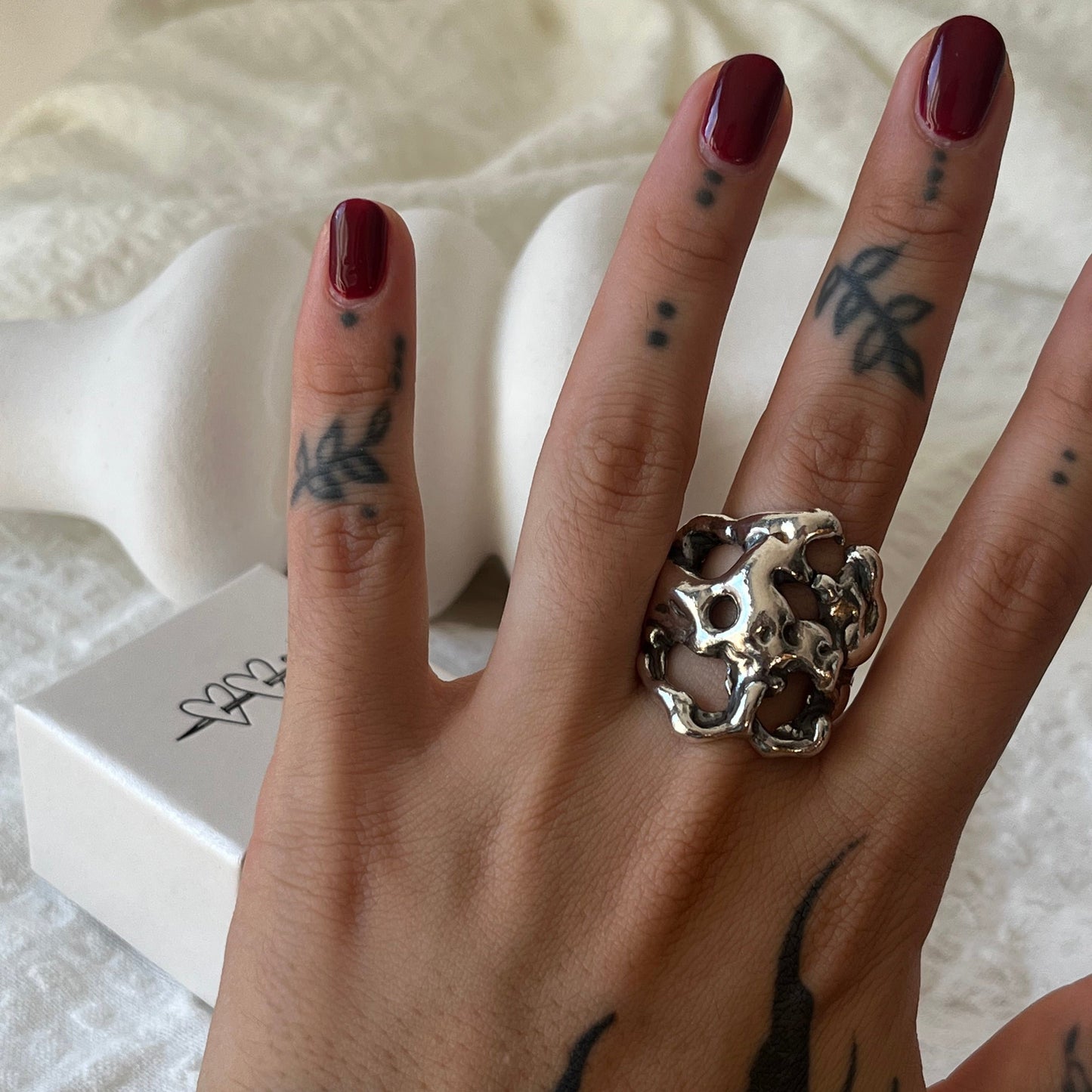 Organic bold ring handmade in sterling silver. Looks like the metal is melting around your finger.