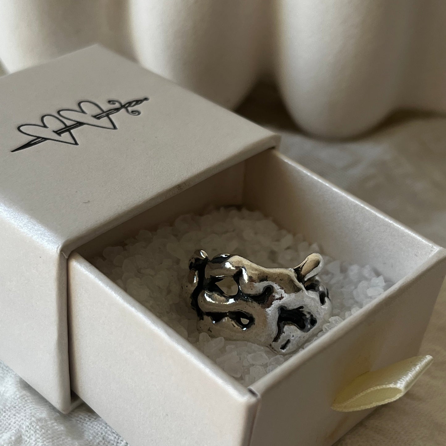 Hand made sterling silver ring with a molten design