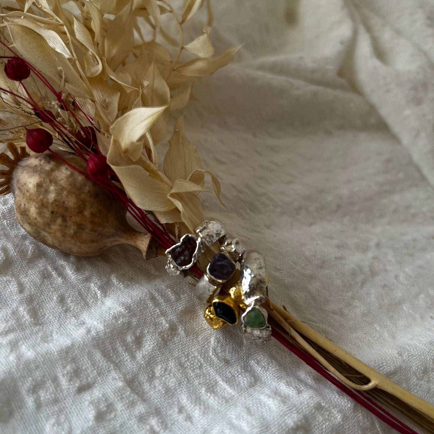 Organic handmade rings in silver and gold plated with different stones in the center