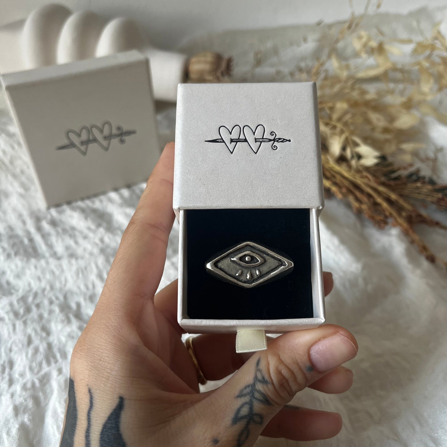 Signet ring with a hand carved eye design