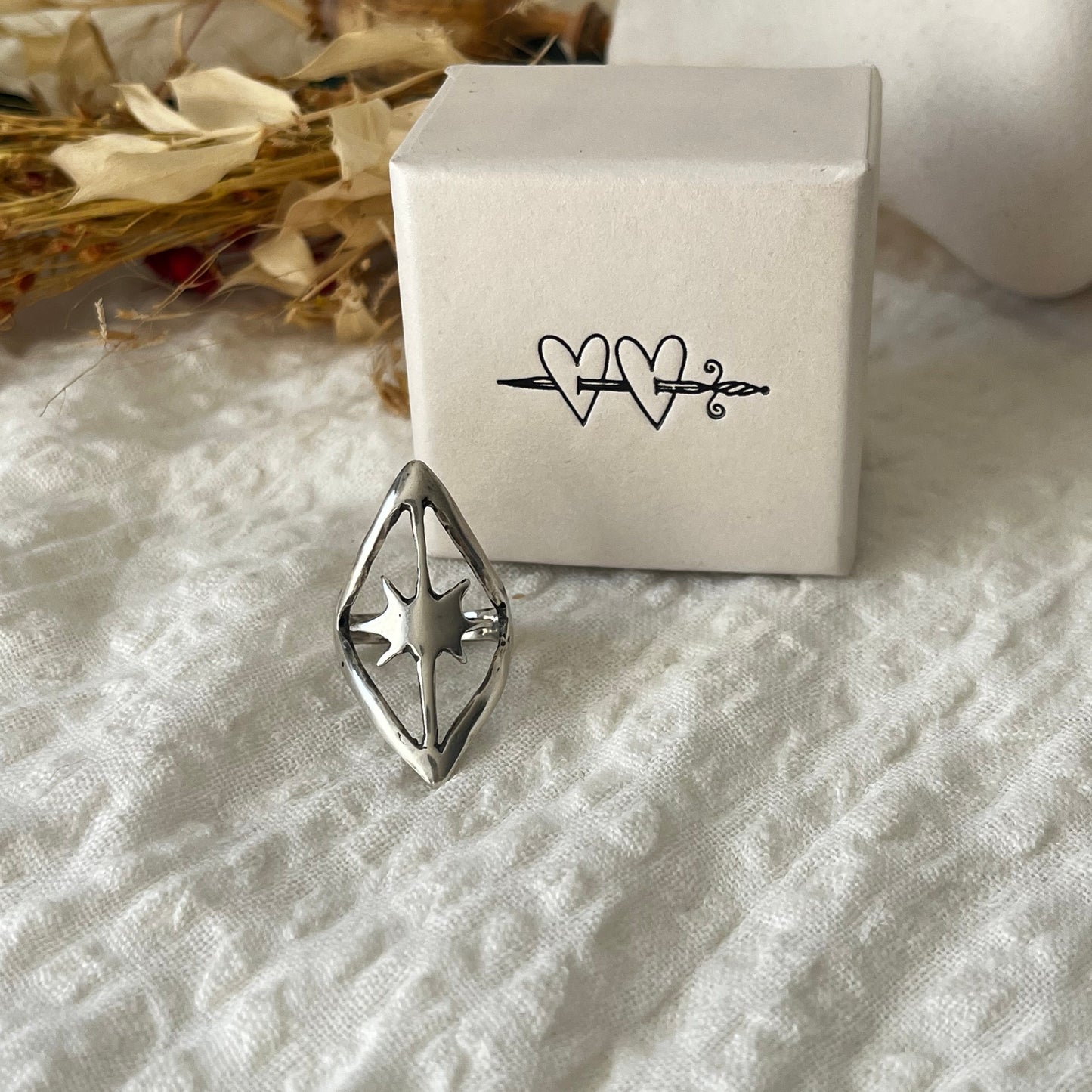 Handmade ring in sterling silver with a star inside a kite shape