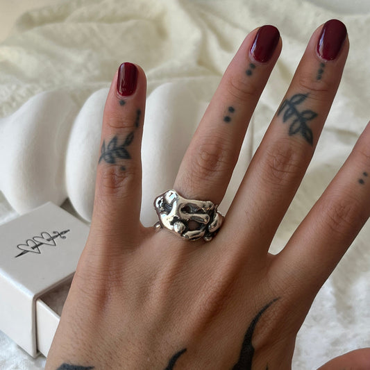 Hand made sterling silver ring with a molten design