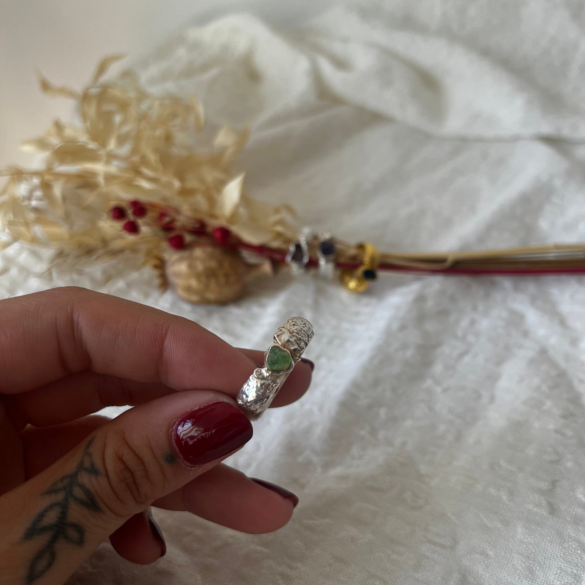 Organic handmade rings in silver with a green sea glass in the center