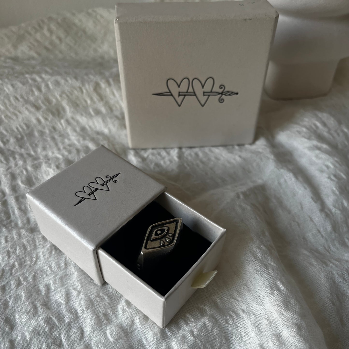 Signet ring with a hand carved eye design Handmade